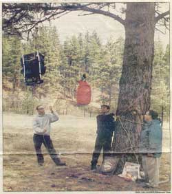 Victor High School junior BenDrewien, left, takes a turn hoisting a back pack to bear-proof a camp, as part of exercises prepared by Chuck Bartlebaugh of The Center for Wildlife Information, foreground. Drewien and Jorge Cano, right, were among several high school students who helped train younger students to be safe and responsible around wildlife. Victor High School junior BenDrewien, left, takes a turn hoisting a back pack to bear-proof a camp, as part of exercises prepared by Chuck Bartlebaugh of The Center for Wildlife Information, foreground. Drewien and Jorge Cano, right, were among several high school students who helped train younger students to be safe and responsible around wildlife.